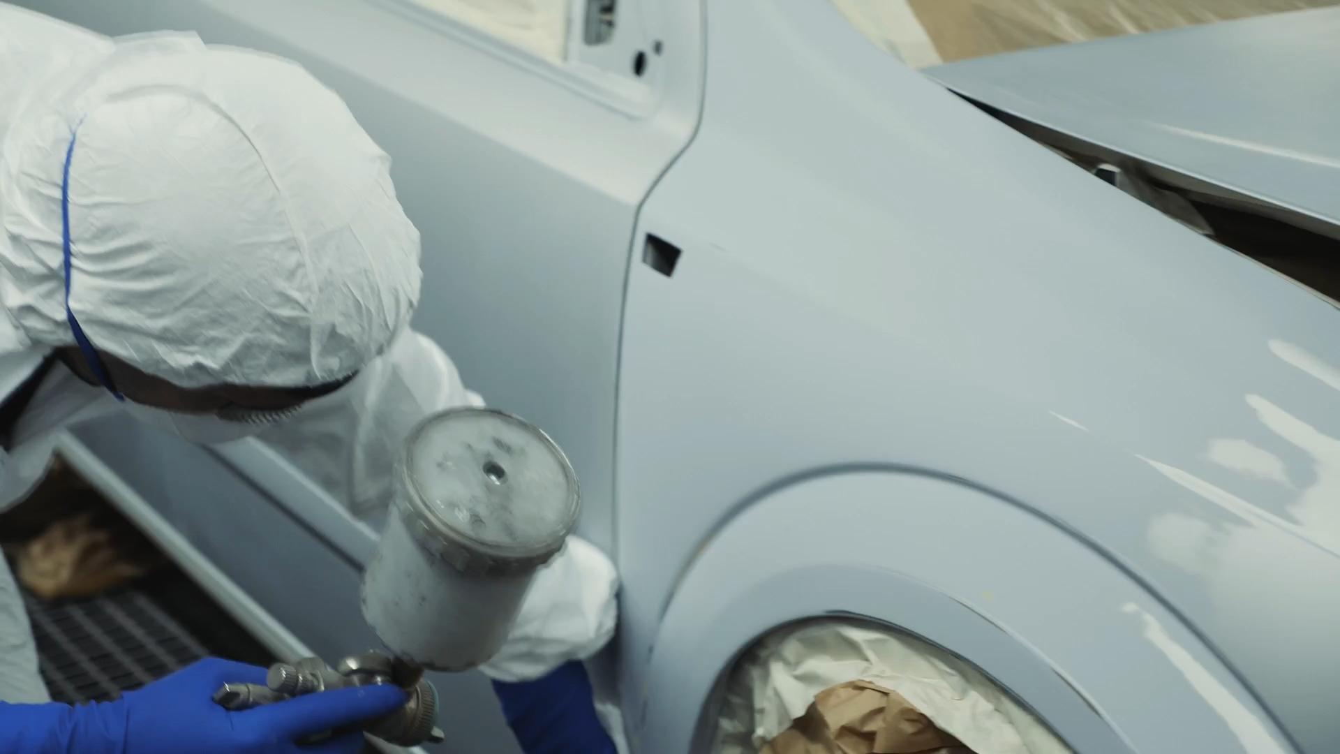 Technician refinishing a vehicle panel at CARSTAR Allstar Collision
